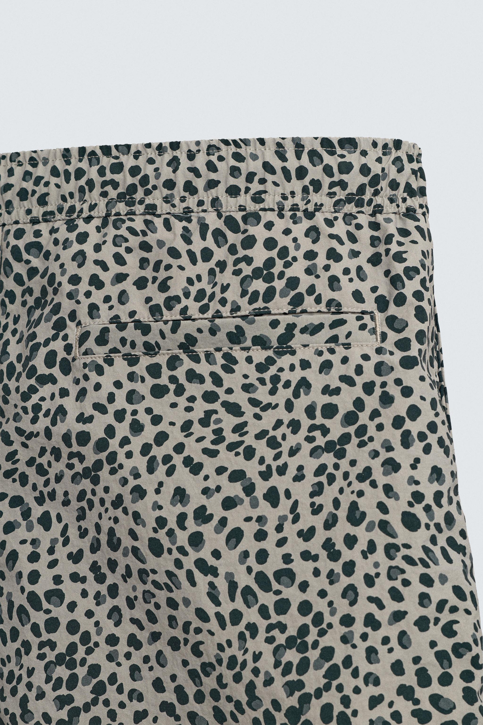 ANIMAL PRINT LONG SWIM TRUNKS